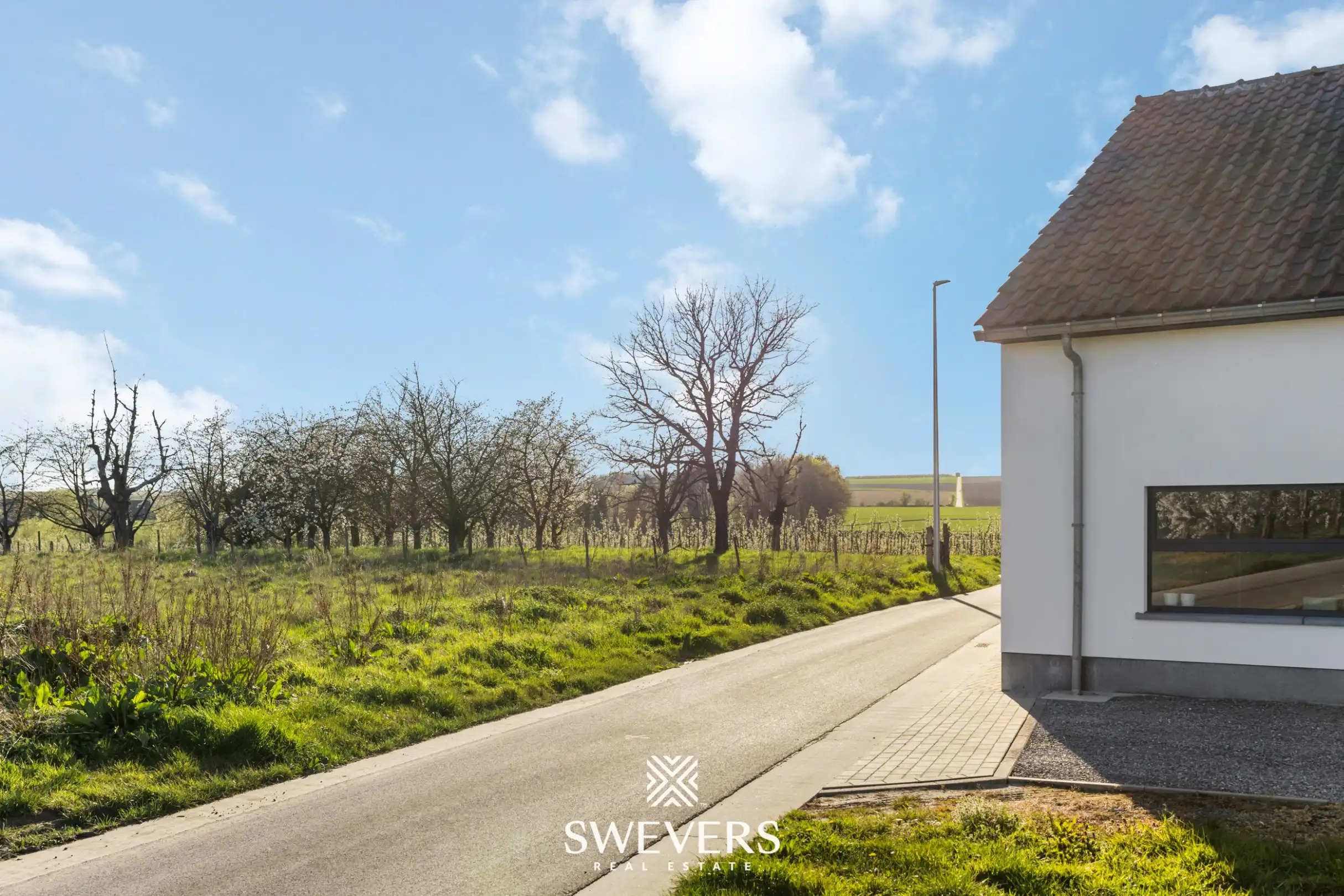 Instapklare open bebouwing met ruime tuin en prachtig uitzicht tussen de boomgaarden in Gingelom foto 29