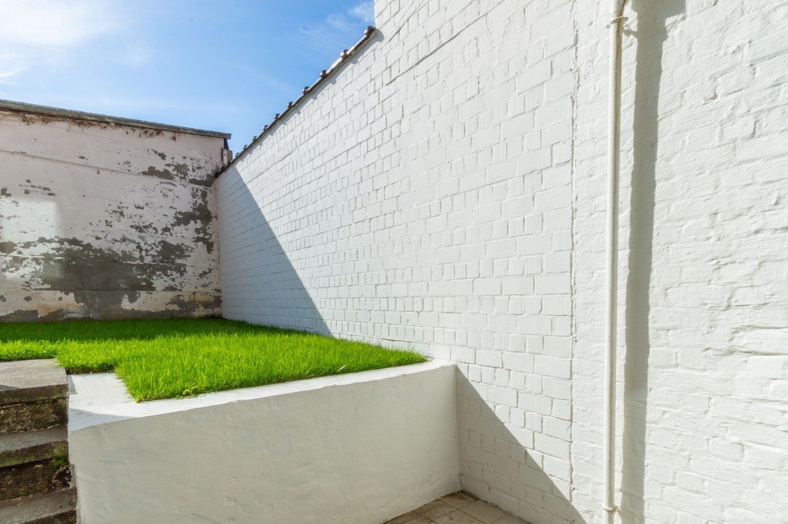 Volledig vernieuwbouwd appartement met 1 slaapkamer + bureau + tuin foto 13