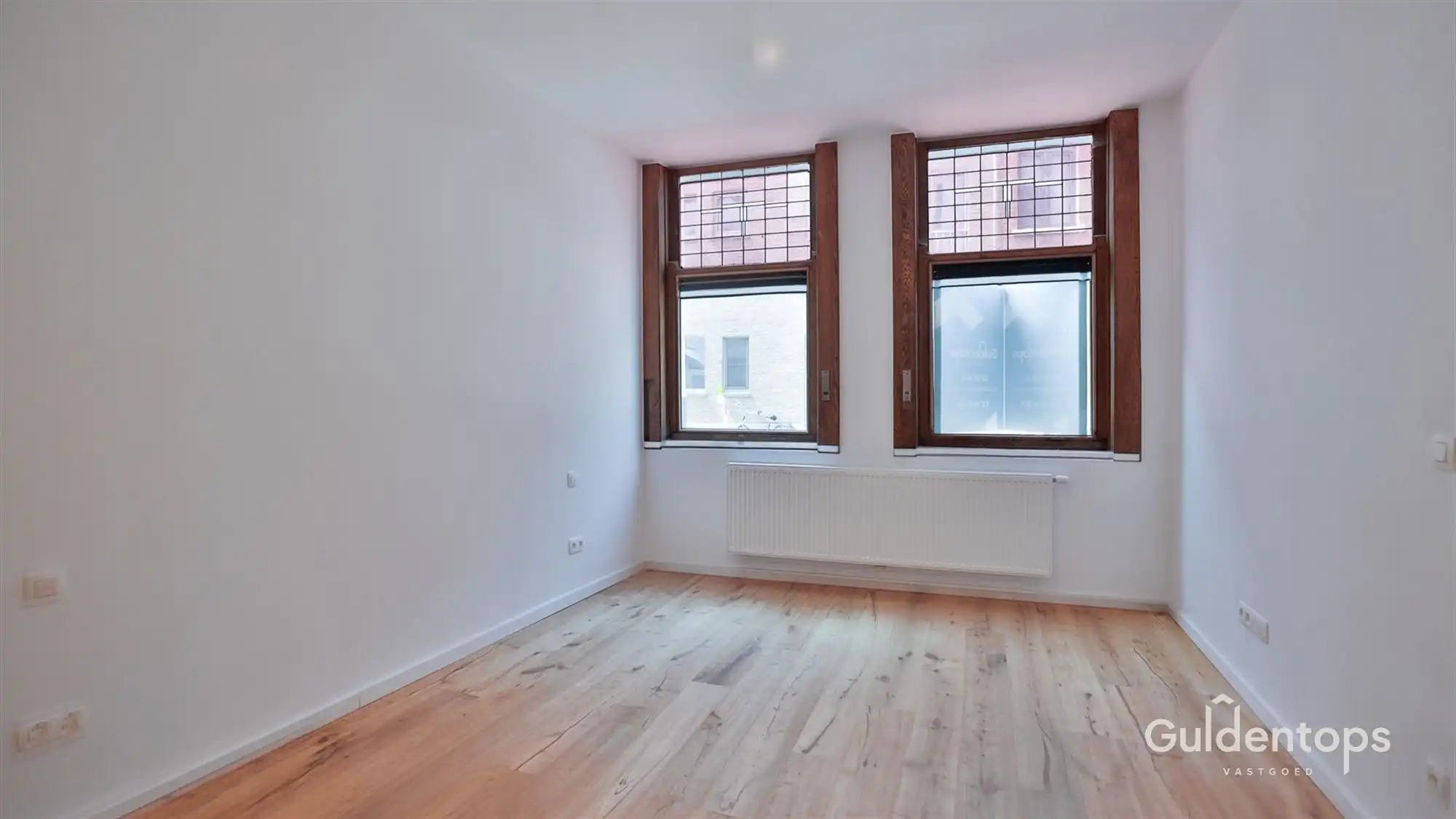 Knap gelijkvloers appartement in hartje Lier met grote tuin foto 9