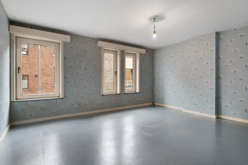 Te renoveren starterswoning met 2/3 slaapkamers en tuinjte foto 12
