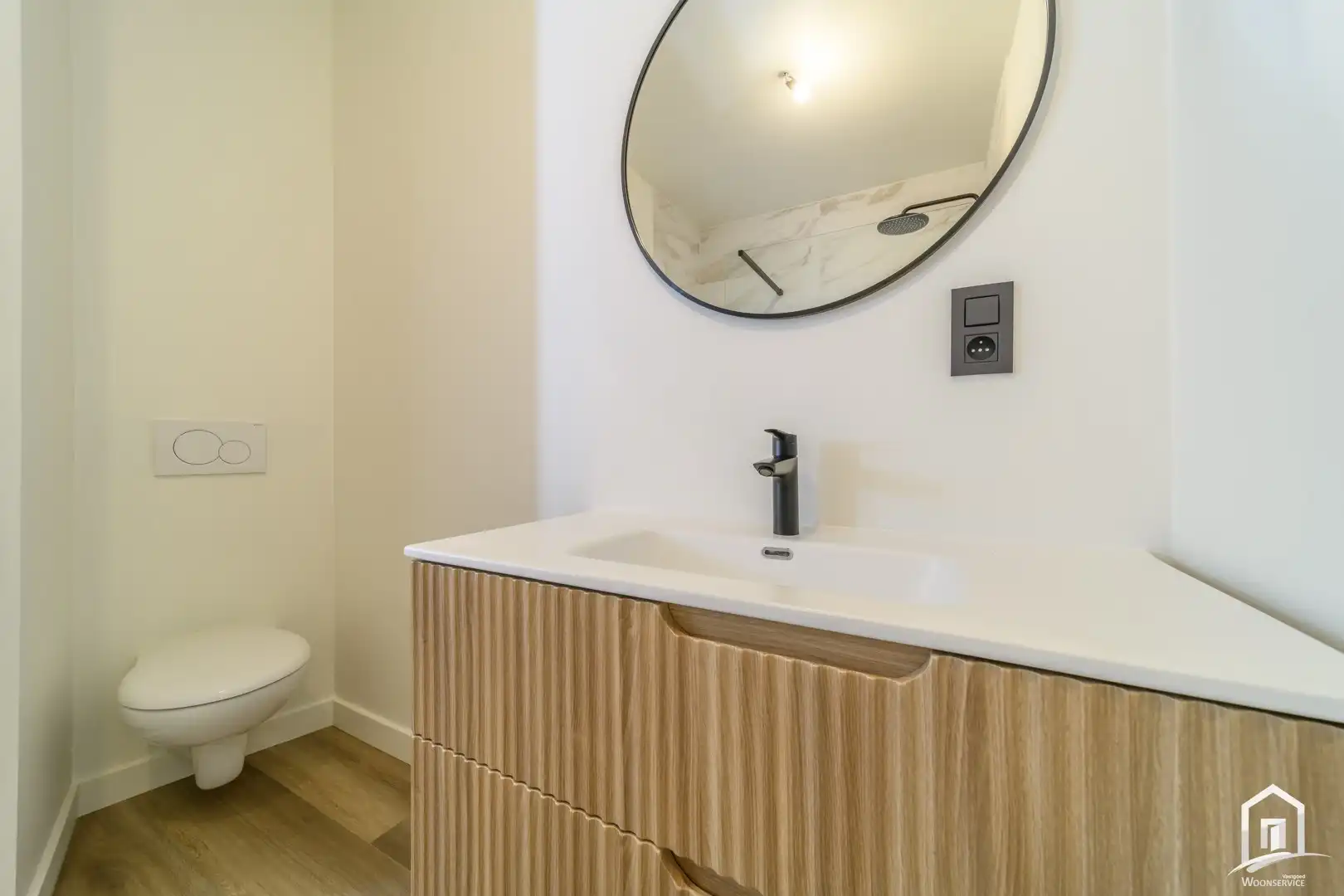 Totaal gerenoveerd gelijkvloers-appartement met tuintje foto 13