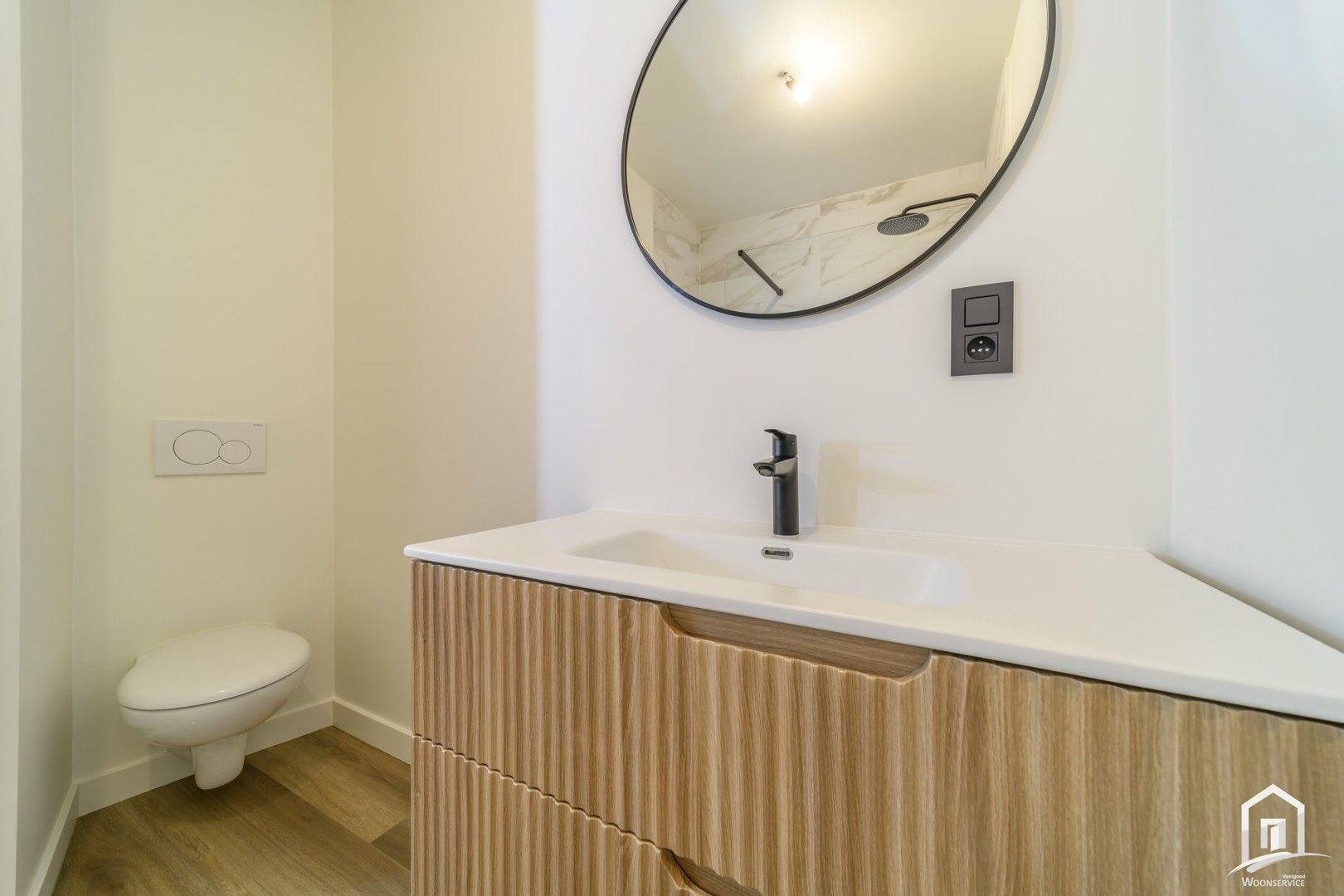 Totaal gerenoveerd gelijkvloers-appartement met tuintje foto 13