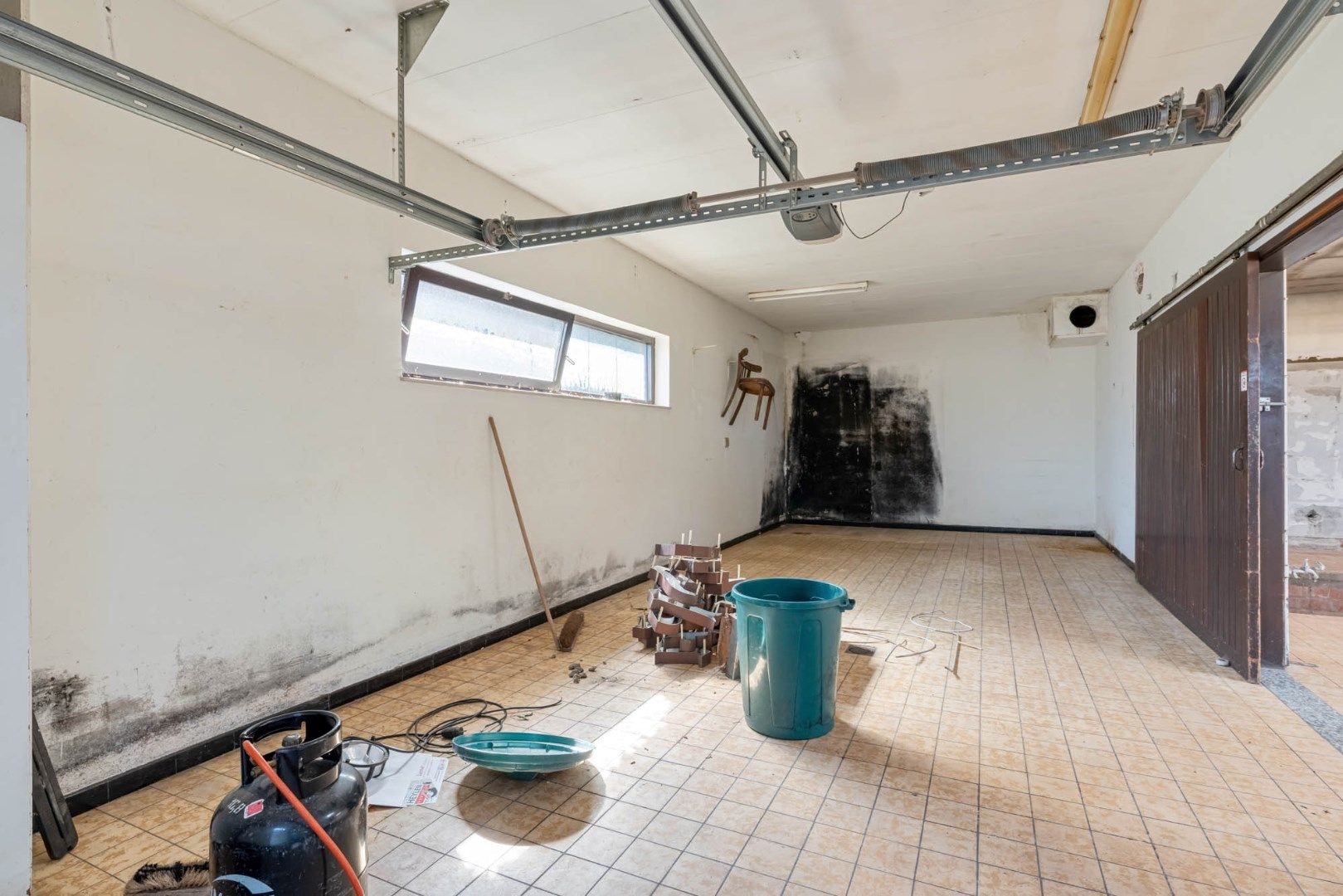 Multifunctioneel gebouw bestaande uit een woning, een winkel en een magazijn/werkplaats gelegen op een rustige locatie te Voorshoven! foto 30
