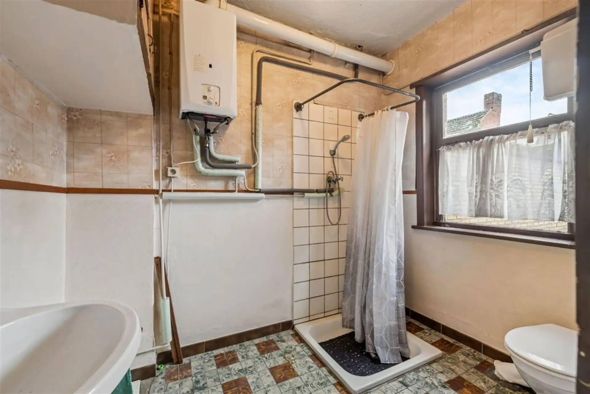 Potentiële gezinswoning of 2 bouwgronden in het hartje van Sint-Gillis-Waas foto 13