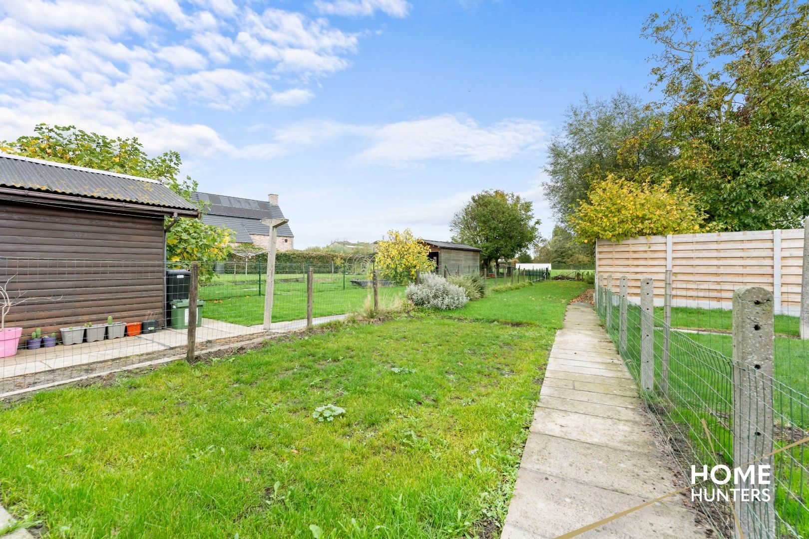 Halfopen gezinswoning met 3 slpks, carport en diepe tuin in Dikkebus foto 7