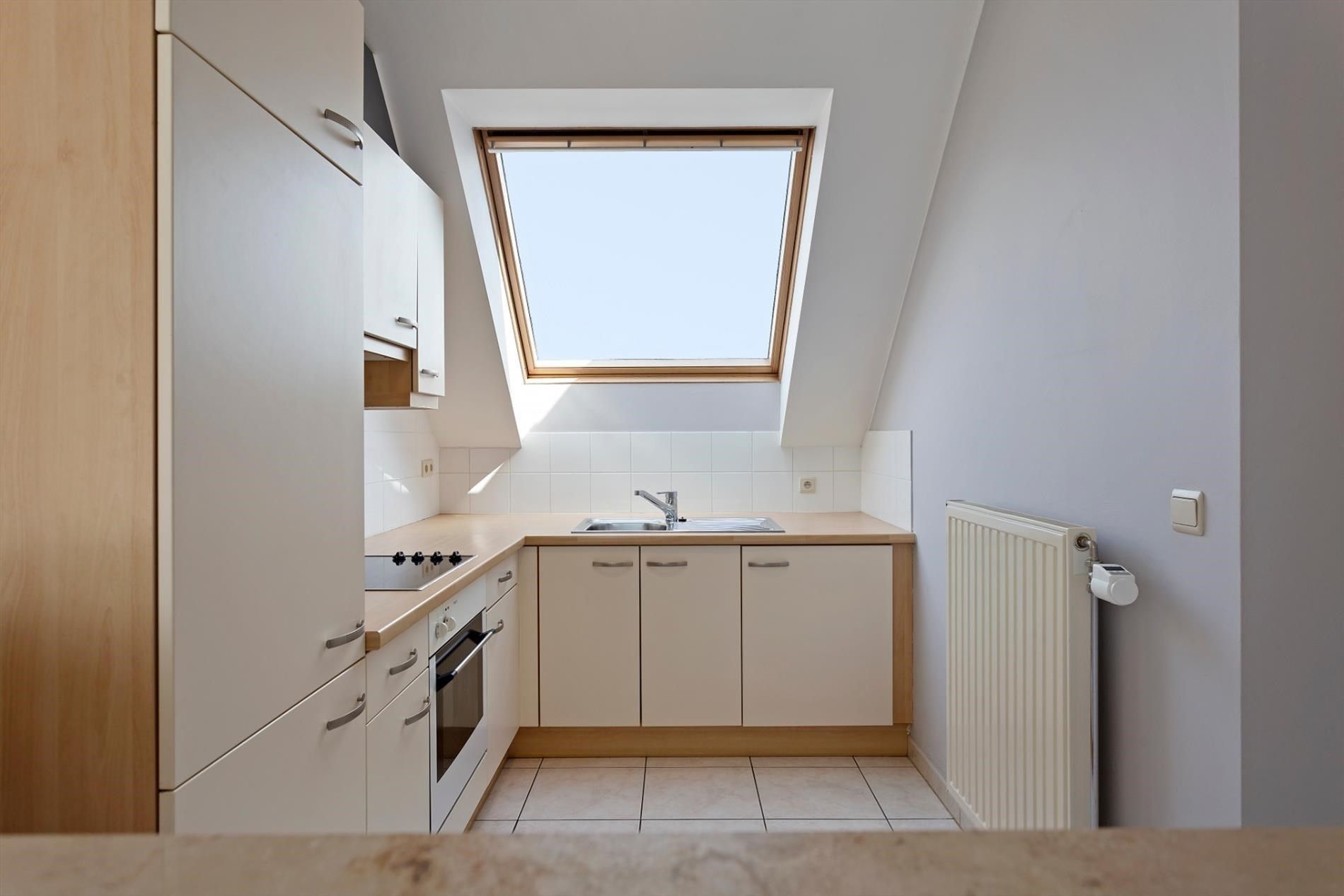 Aangenaam en luchtig appartement met 1 slaapkamer, terras & autostandplaats in ondergrondse garage in hartje Hoeselt foto 13