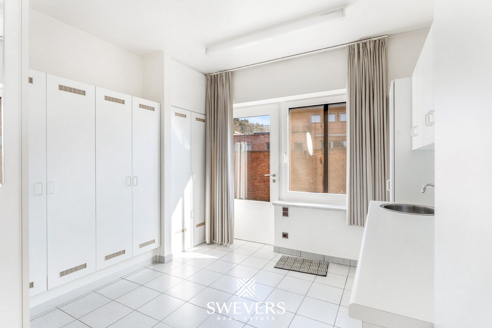 Handelspand met ruime woning in hartje Lummen – een unieke opportuniteit foto 11