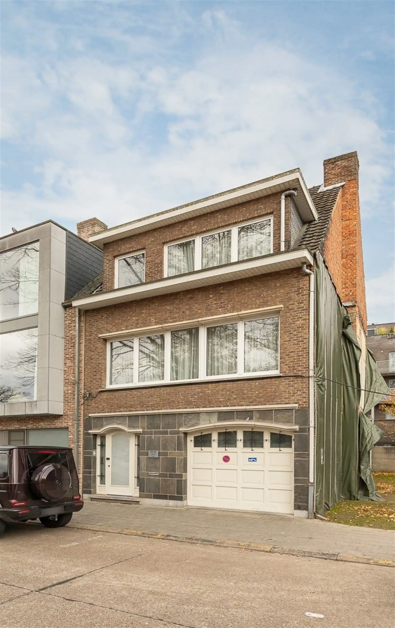 Ruime gezinswoning met tuin en garage met zicht op het park van Brasschaat foto {{pictureIndex}}