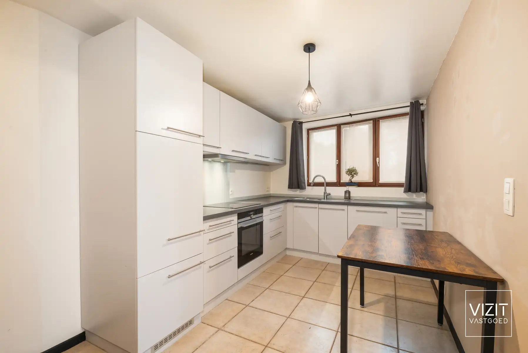 Rustig gelegen halfopen woning met tuin in Meerbeke foto 6