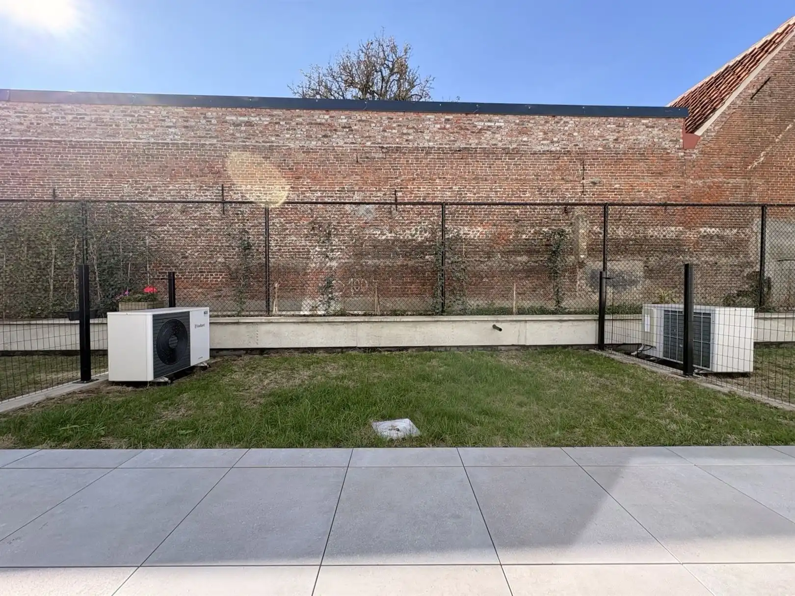 Modern en instapklaar gelijkvloers appartement met terras, tuin en ondergrondse staanplaats in Grembergen foto 14