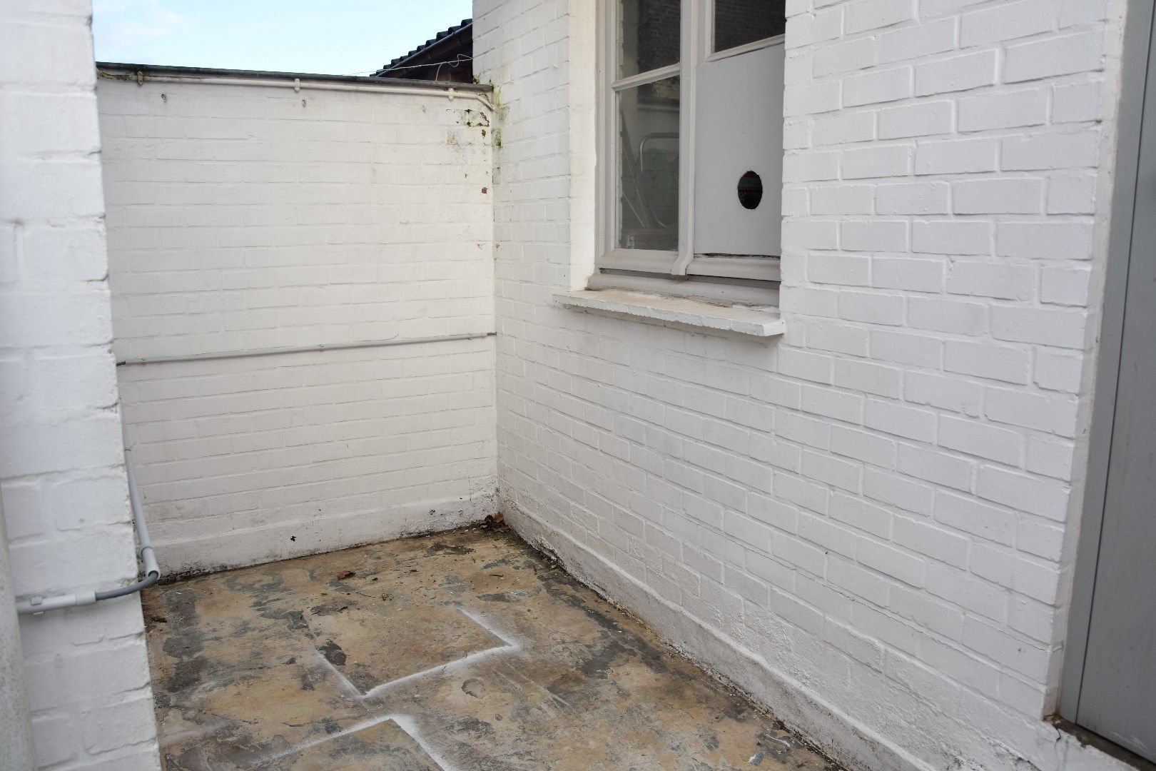 Opgefriste rijwoning met stadskoertje foto 12