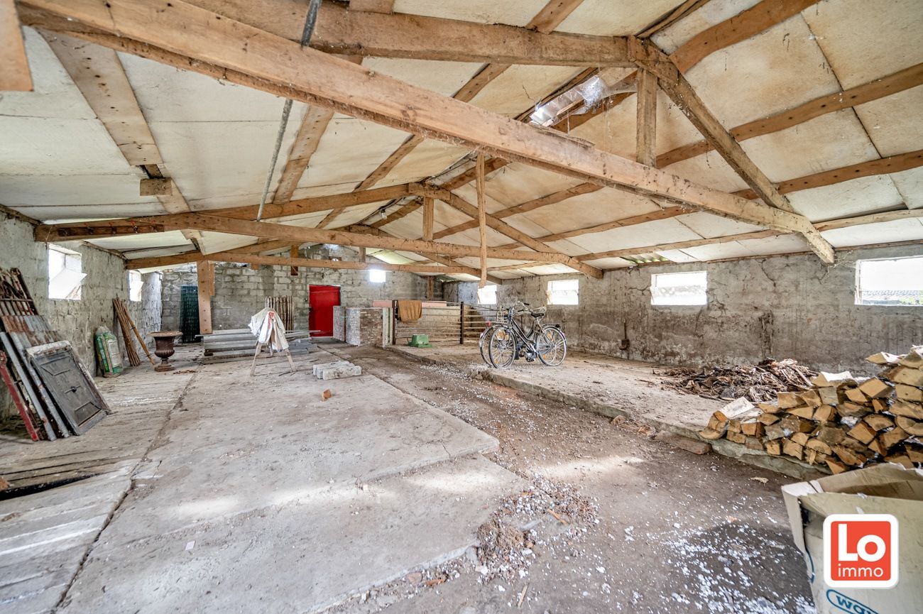 Landelijk gelegen halfopen woning met verschillende stallingen op groot perceel grond met open zicht in Zeveneken! foto 28