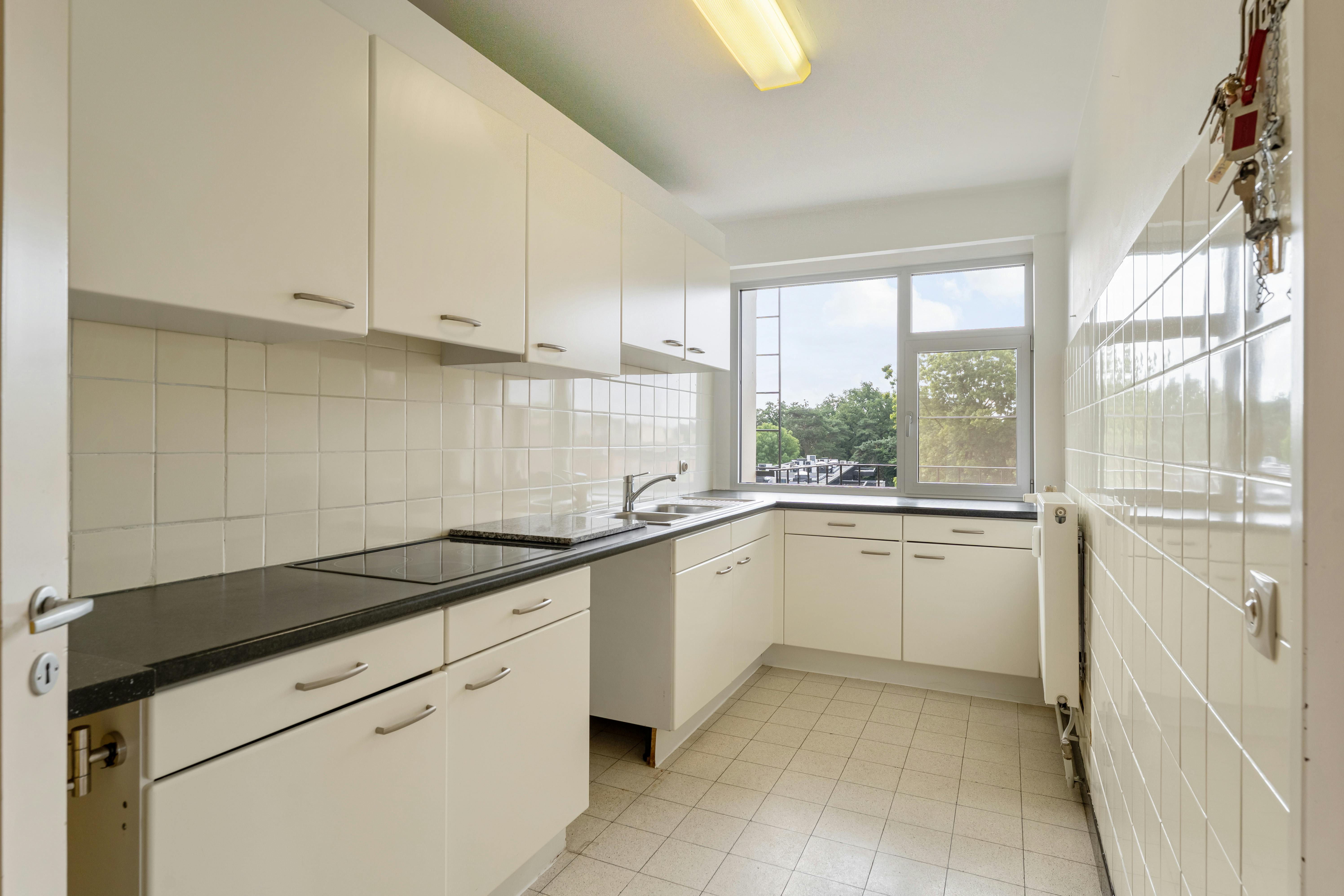 Ruim 3-slaapkamerappartement met terras en garagebox in hartje Genk foto 18