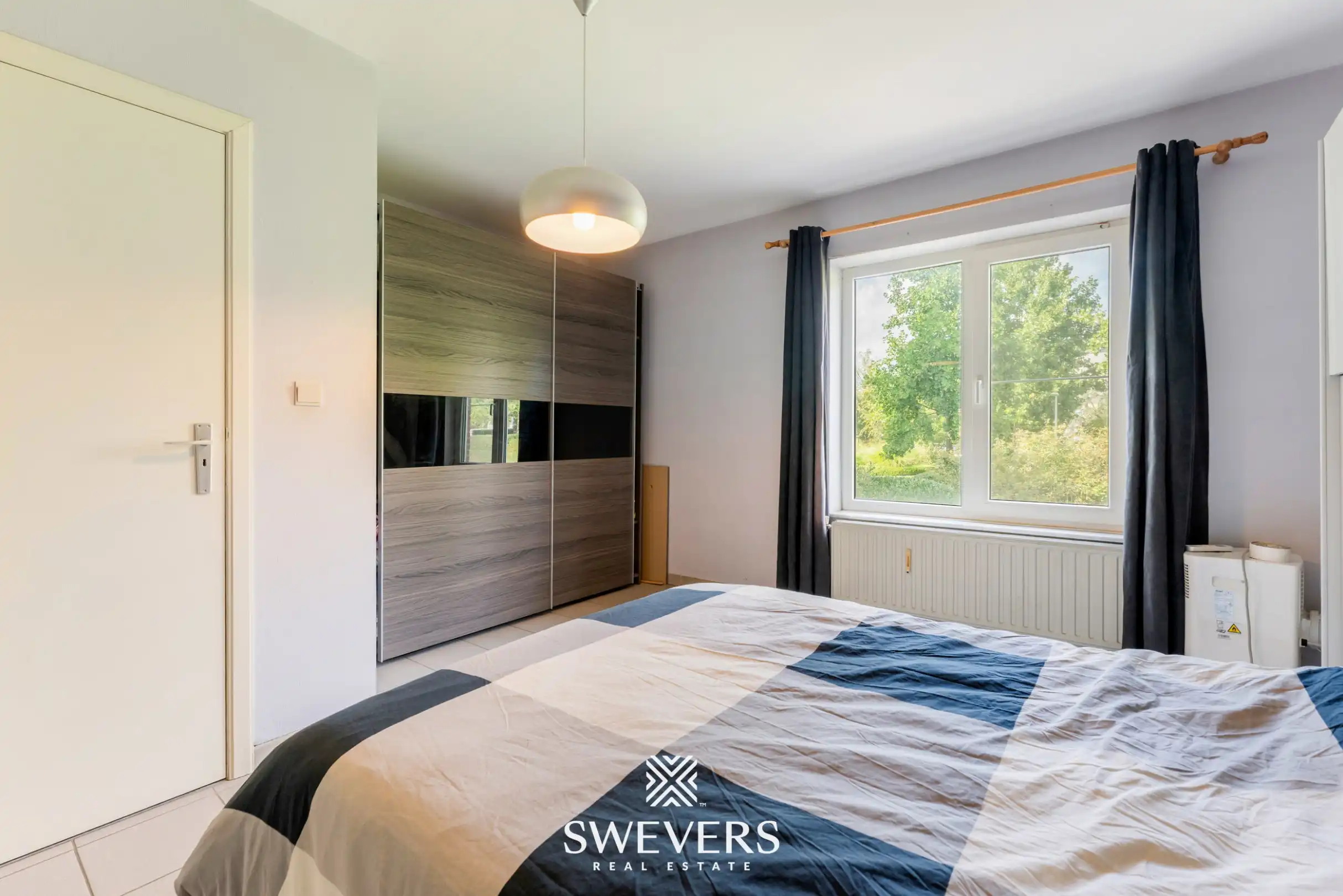 Ruim gelijkvloers 3-slaapkamerappartement inclusief autostaanplaats en kelderberging nabij Hasselt-centrum foto 15