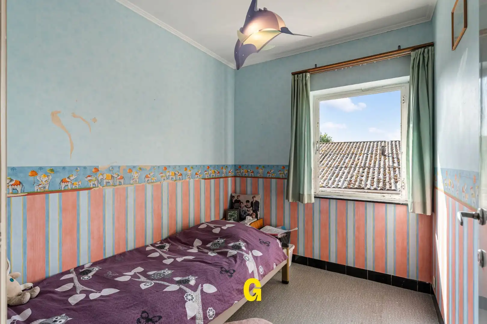 Grondig te renoveren woning met degelijke structuur en ruime tuin op 10a 67ca, met weids zicht op de achtergelegen glooiende groene omgeving foto 14