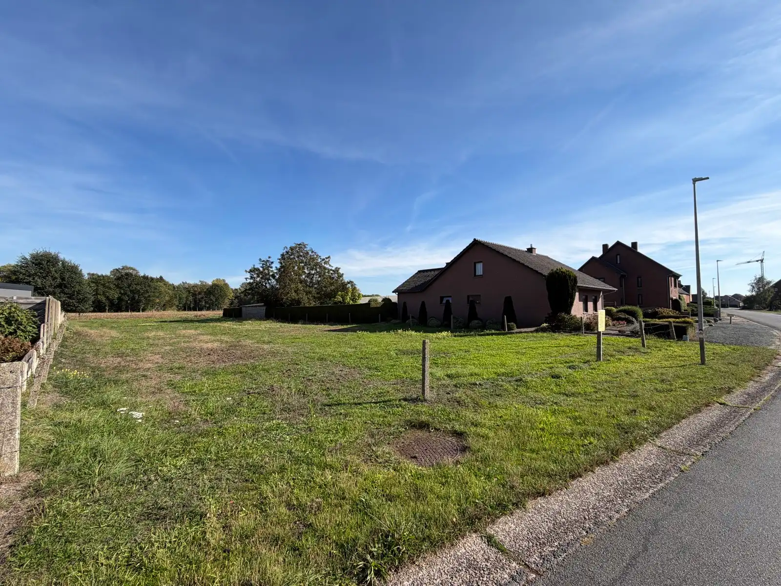 Bouwgrond van 1.154 m² met zicht op velden foto 3