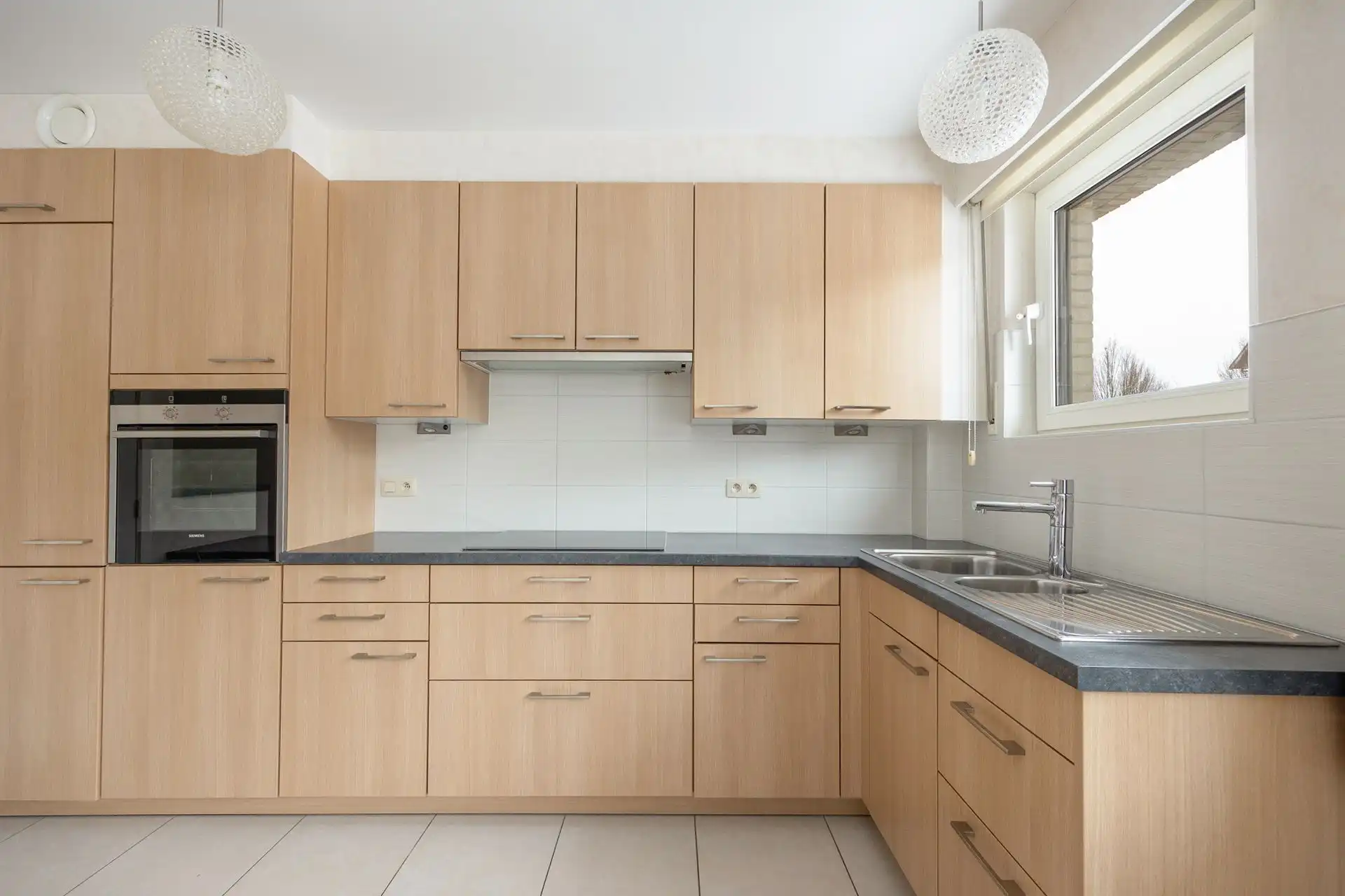 Gelijkvloersappartement met grote tuin & garage foto 6