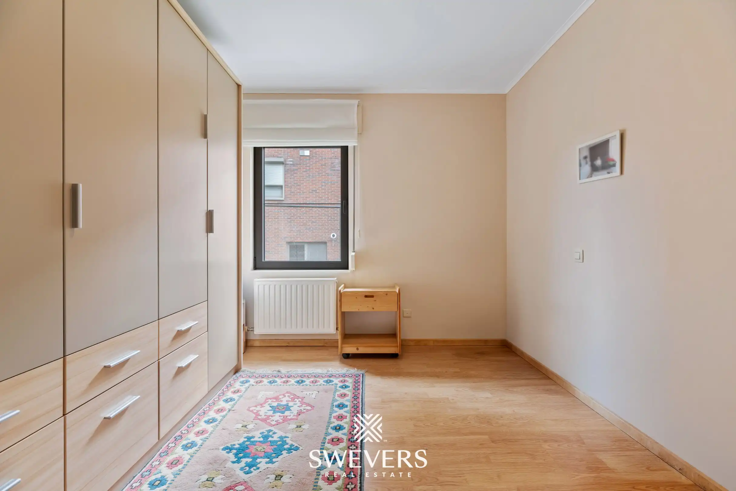 Ruim gelijkvloers appartement met tuin en ondergrondse autostaanplaats foto 17