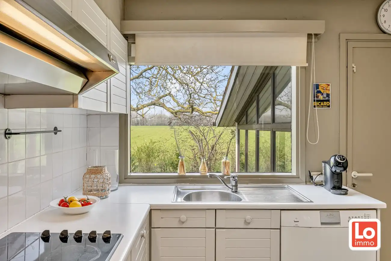 Ruime volledig te renoveren open gelijkvloerse prefab woning met inpandige garage en tuin met open zicht of perceel bouwgrond met afbraak/heropbouw mogelijkheden aan 6% BTW op een rustige locatie nabij het centrum van Zeveneken! foto 15