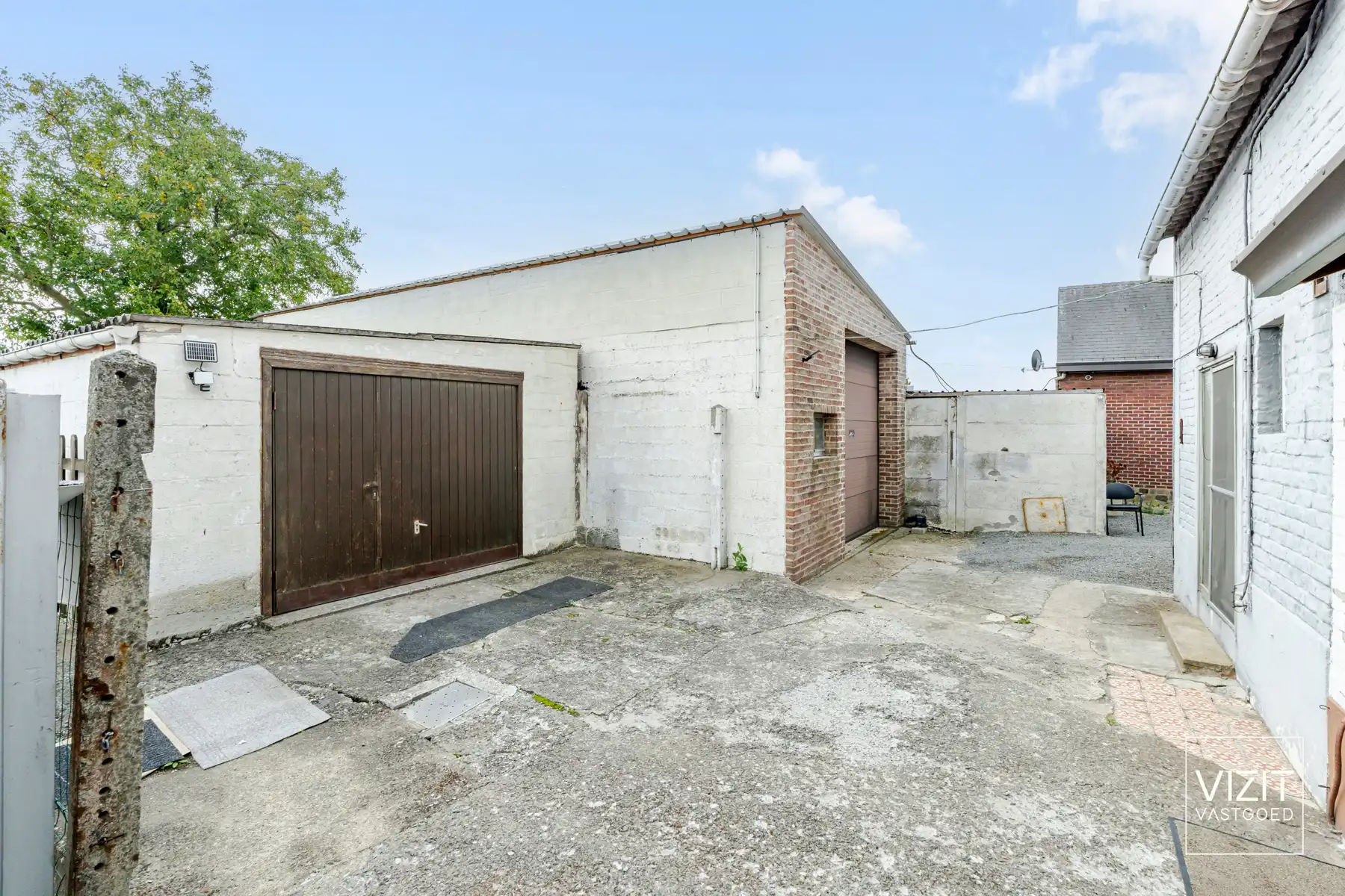 Te renoveren woning met ruime garage en tuin! foto 13
