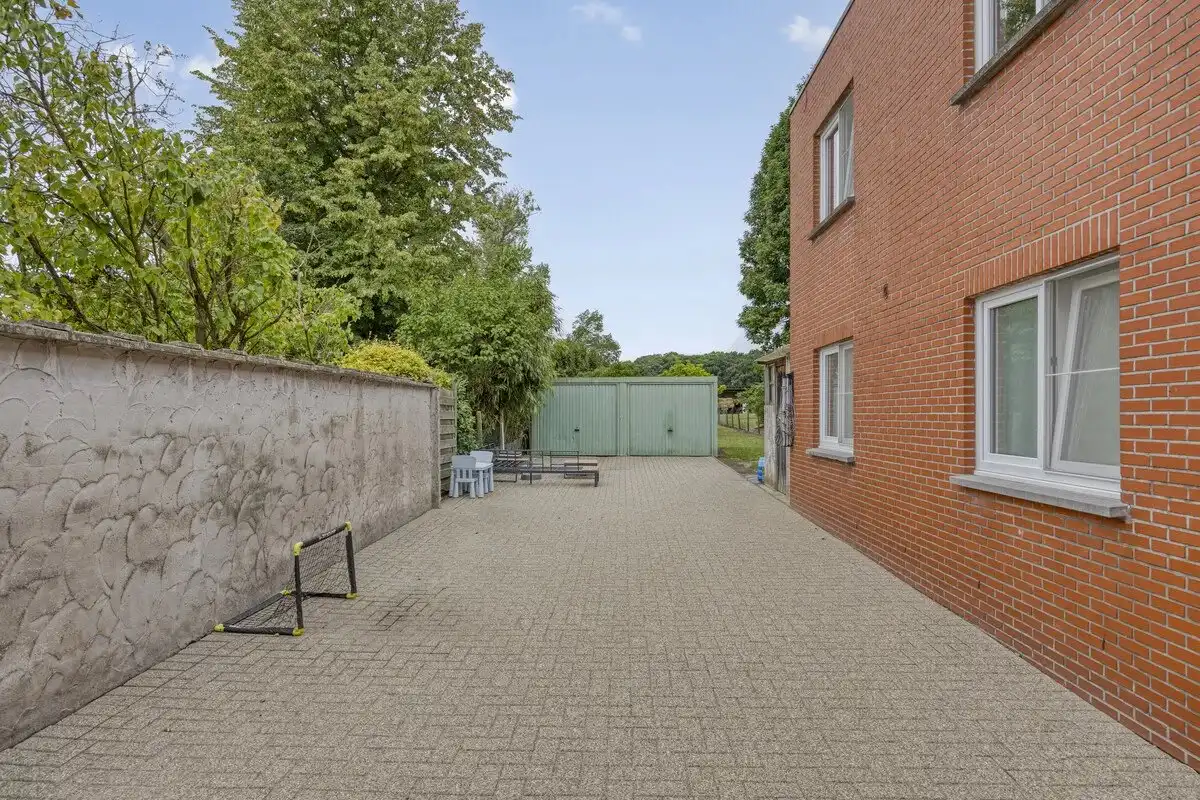 OPBRENGSTEIGENDOM BESTAANDE UIT TWEE RUIME EN VERHUURDE APPARTEMENTEN IN HERK-DE-STAD foto 7