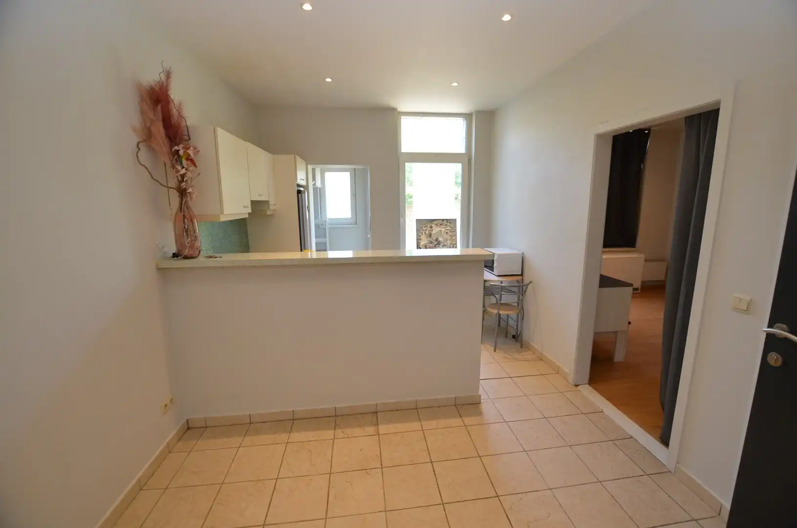 Gelijkvloers appartement met grote koer foto 5