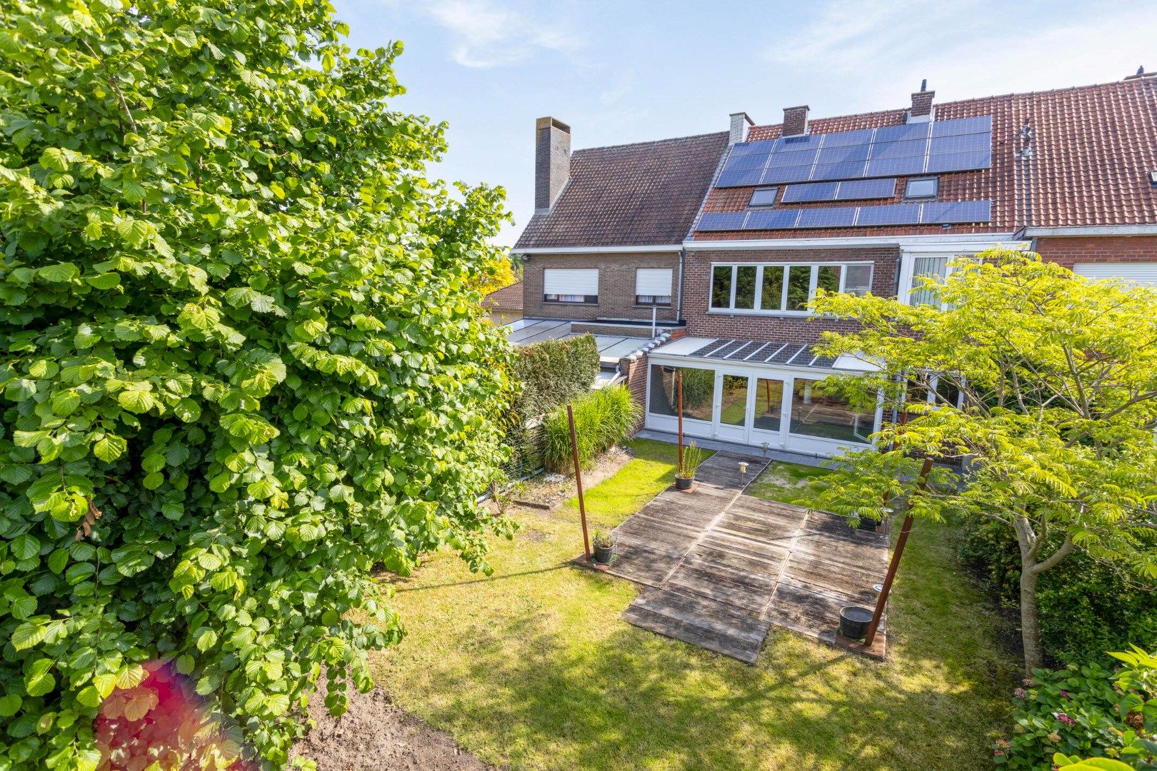 Woning met twee woonentiteiten, garage en tuin  foto 26