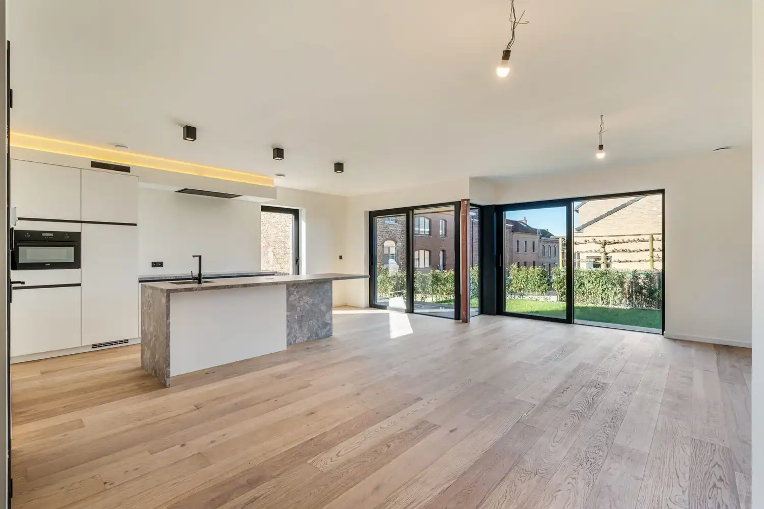 Instapklaar nieuwbouwappartement met 2 slaapkamers, tuin en terras in het centrum van Borgloon foto 2