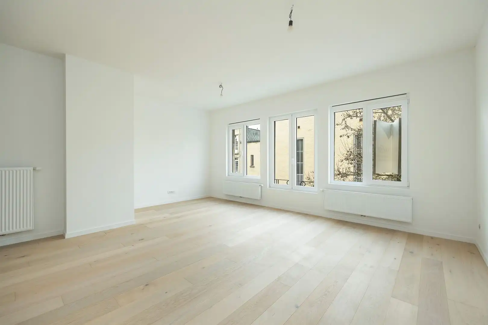 Ruim en licht 2-slaapkamerappartement met dakterras foto 2