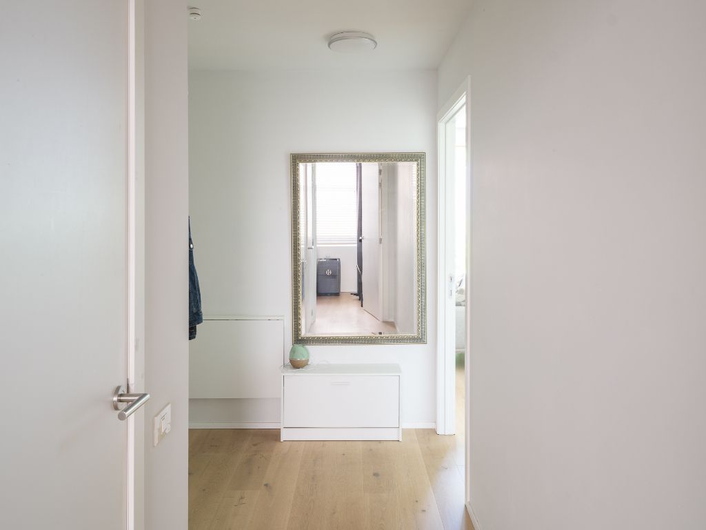 Hedendaags gelijkvloers appartement met één slaapkamer en stadstuin, gelegen in de voormalige brandweerkazerne en de vroegere kunstacademie, midden in het historisch hart van Gent. foto 17
