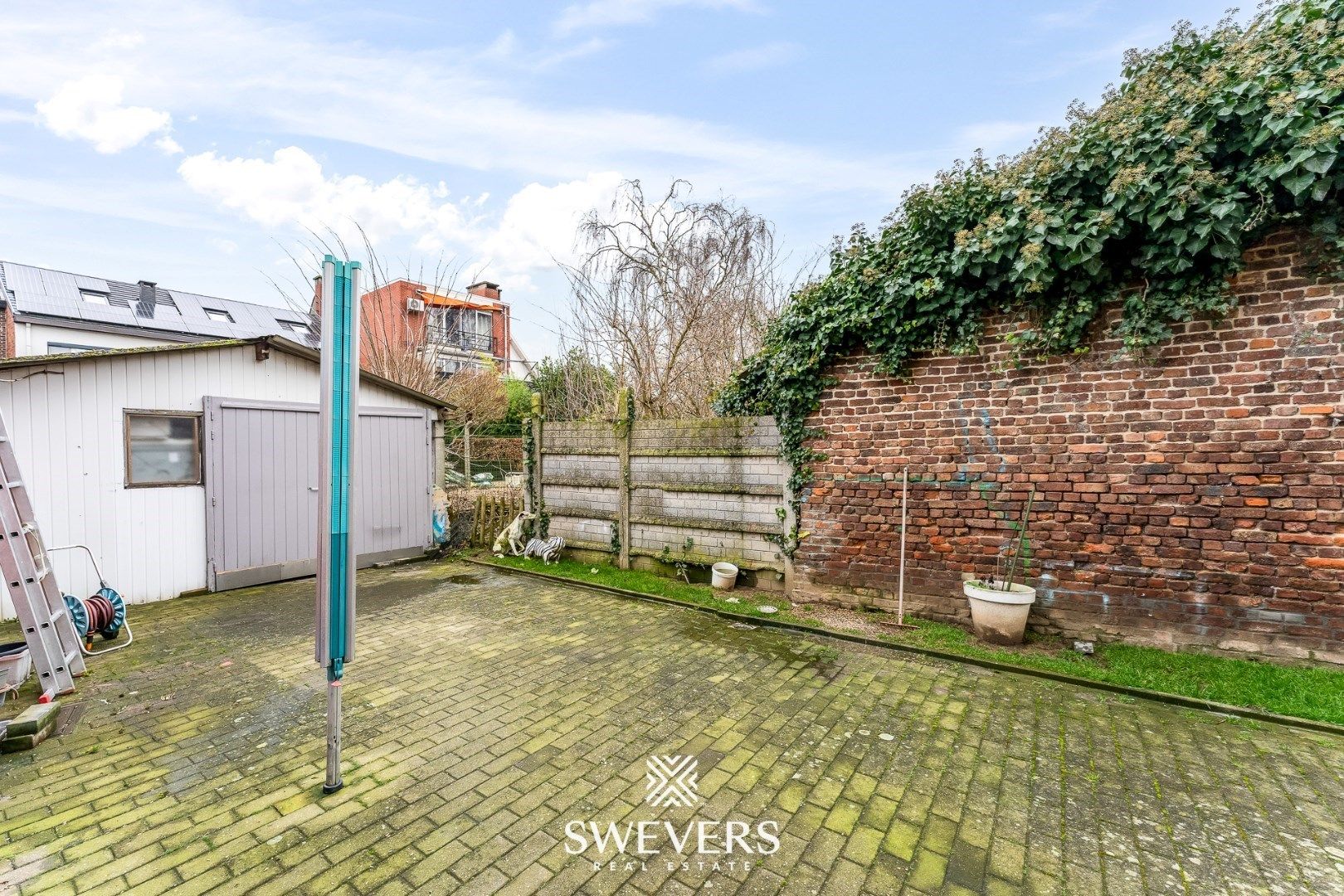 Charmante halfopen woning met renovatiepotentieel in Sint-Truiden foto 24