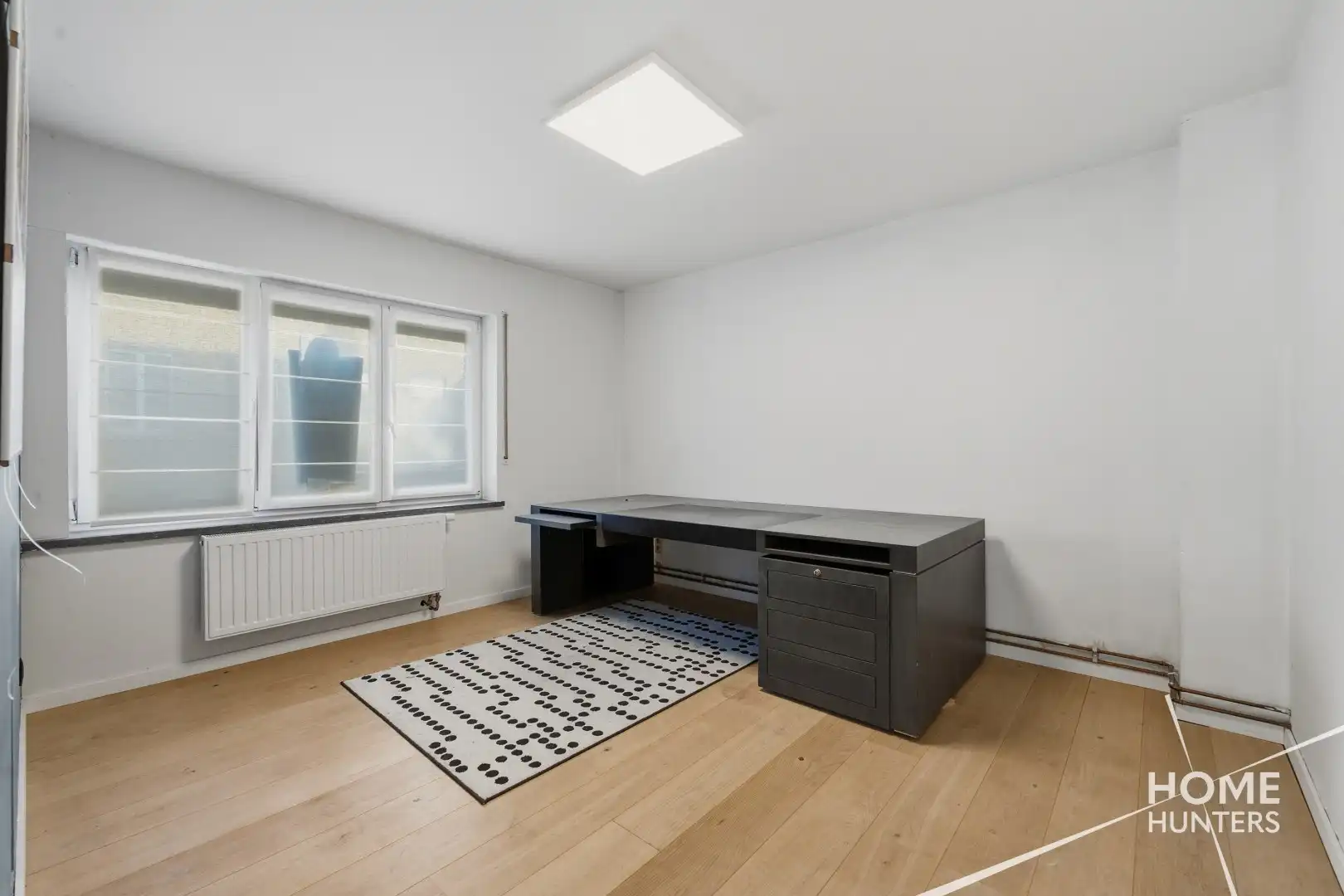 Prachtig gerenoveerde woning met 4 slaapkamers en een ruime tuin vlak bij het historische hart van Ieper! foto 16