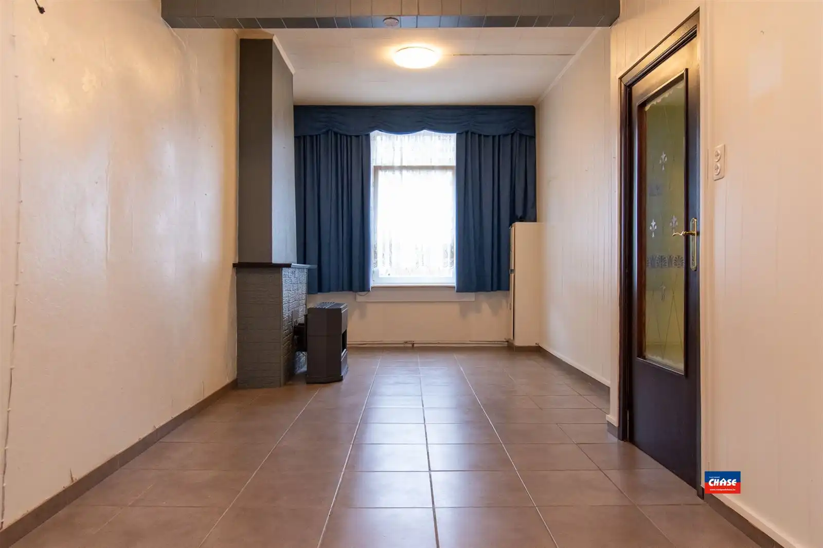 Te renoveren rijwoning met twee slaapkamers en tuin foto 2