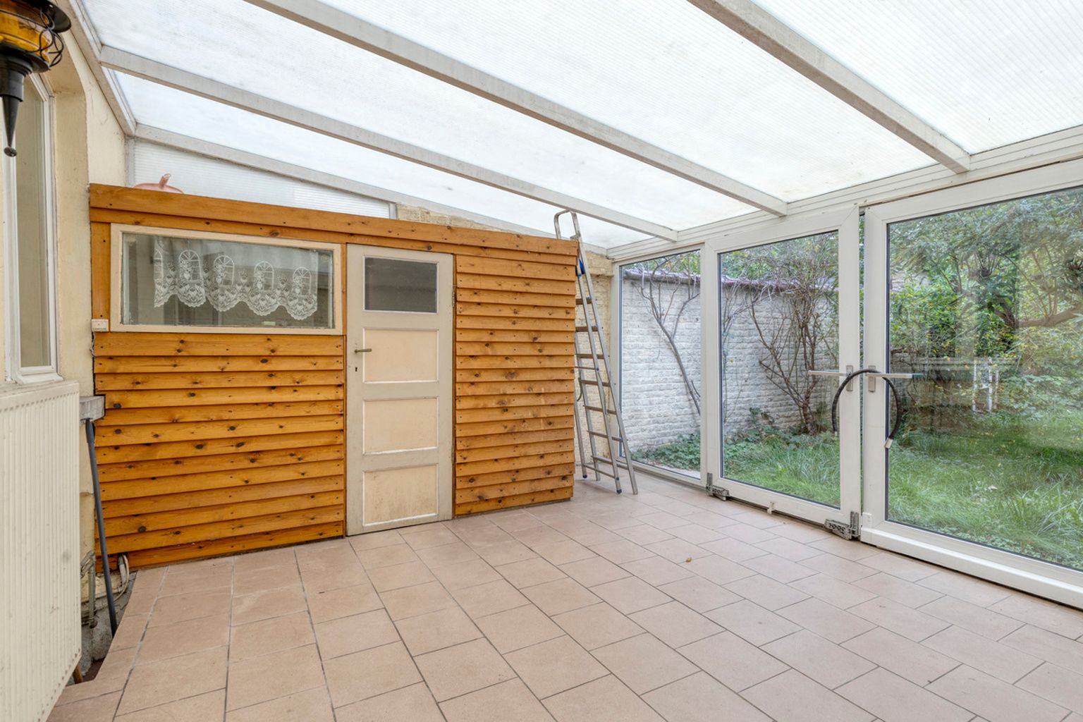 Te renoveren herenhuis met tuin nabij Sint-Guidoplein foto 10