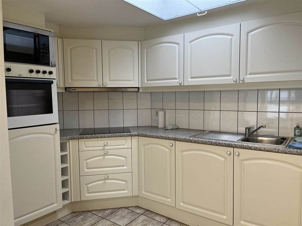 Gezellig en instapklaar triplex appartement met 2 slaapkamers in het centrum van Opoeteren foto 6