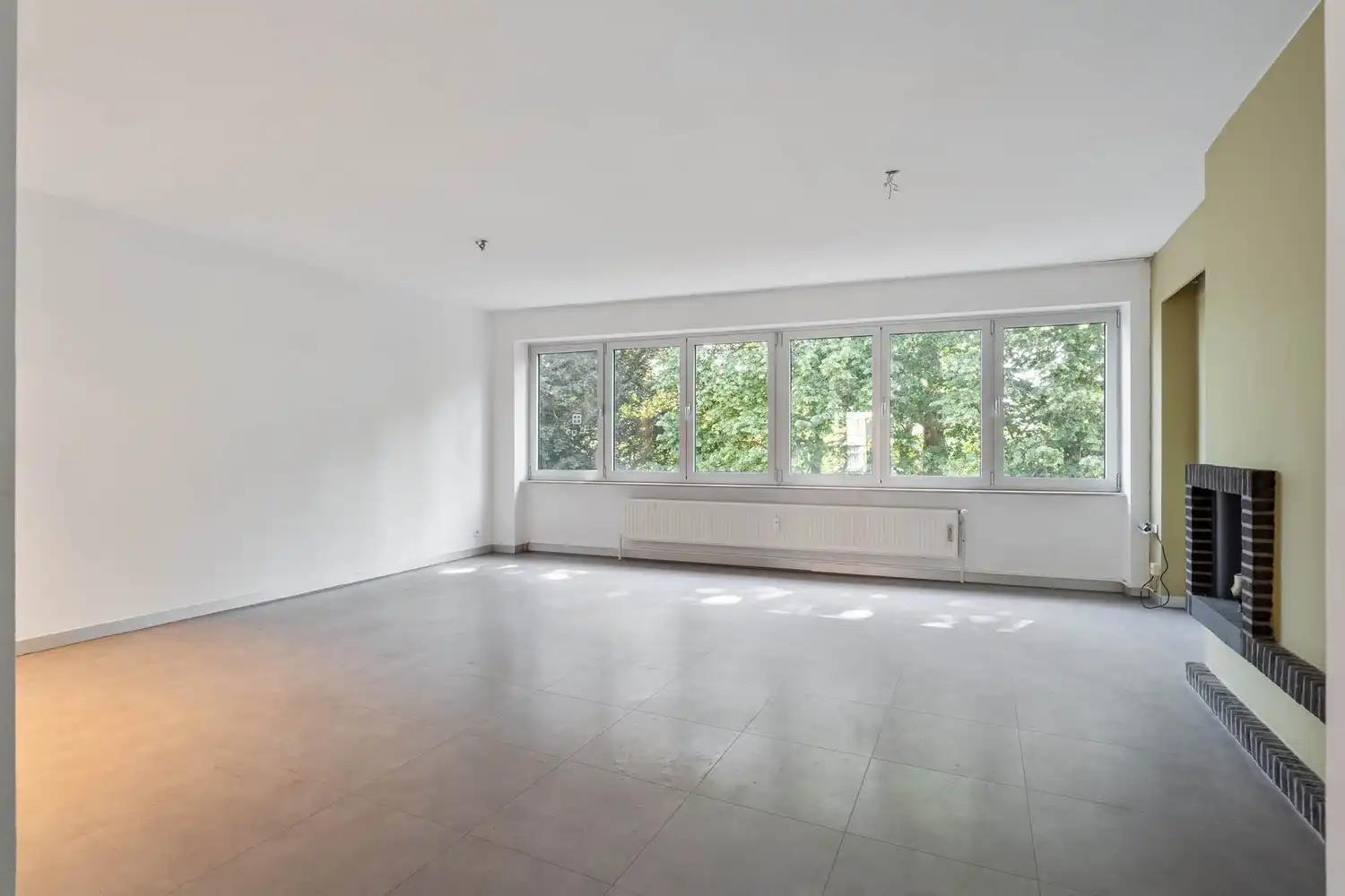 Goed gelegen, lichtrijk en energiezuinig appartement met 2 slaapkamers, een terras en een gemeenschappelijke tuin tegenover de botanische tuin en nabij het UZ Gasthuisberg te centrum Leuven! foto 6