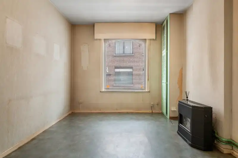 Te renoveren starterswoning met 2/3 slaapkamers en tuinjte foto 3