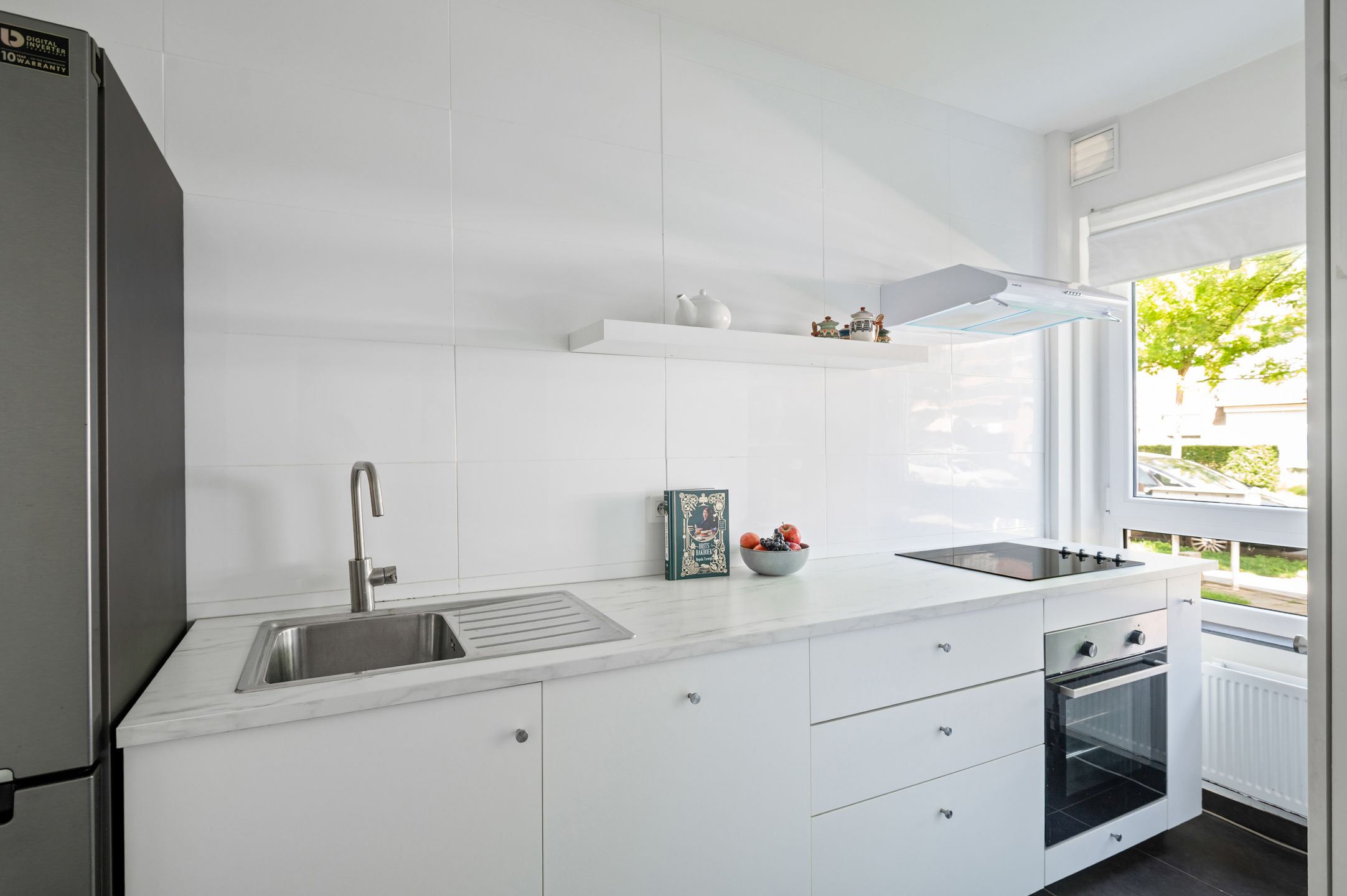 Mooi gelijkvloers appartement met 2 slk., tuin en garagebox foto 5