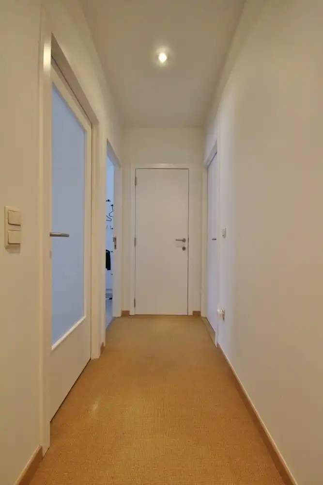 Gezellige triplex op toplocatie met 2 slaapkamers, terras en ondergrondse autostaanplaats foto 14