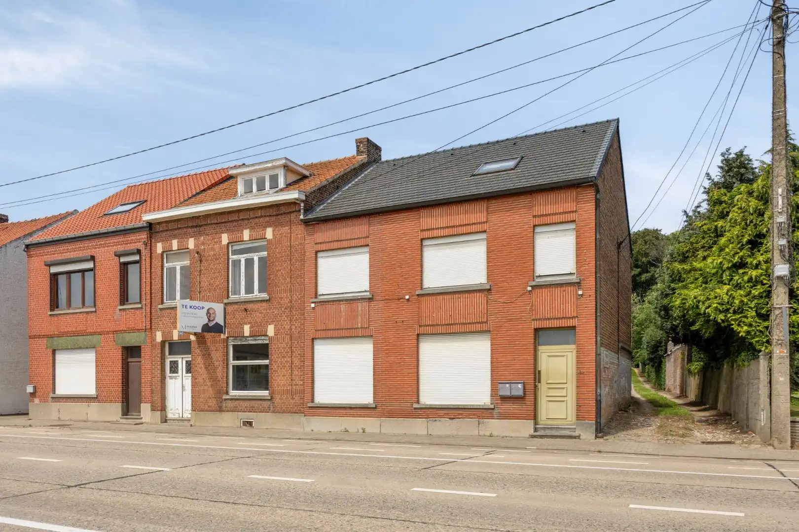 Ruime te renoveren woning met 3 slaapkamers in Lubbeek met doorgang langs het perceel van de buren. EPC: 736 KWH/m² foto 2
