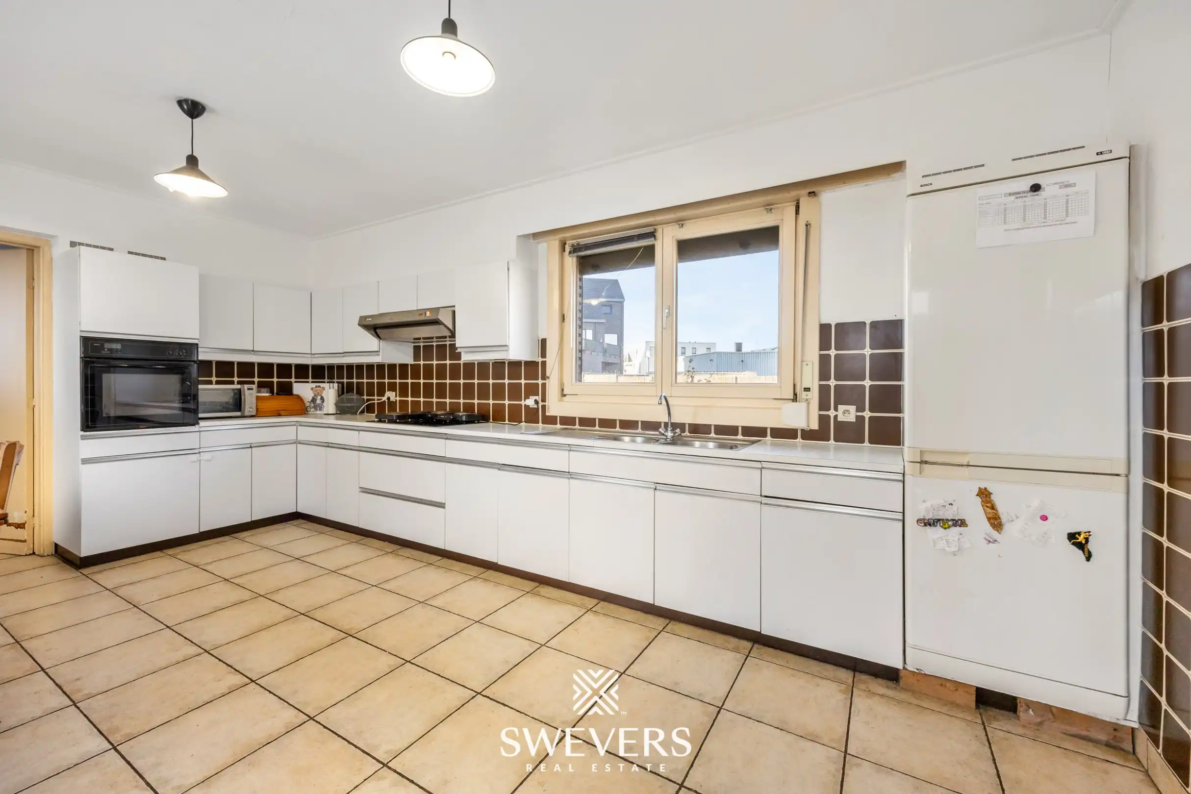 Te renoveren open bebouwing met ruime volumes en zuidgericht perceel in Heusden   foto 9