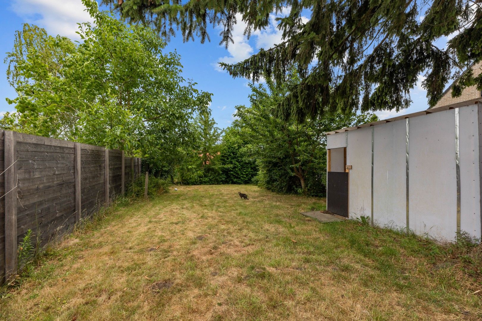 Halfopen gezinswoning in het hart van het landelijke Gontrode, met zicht op agrarisch gebied foto 18