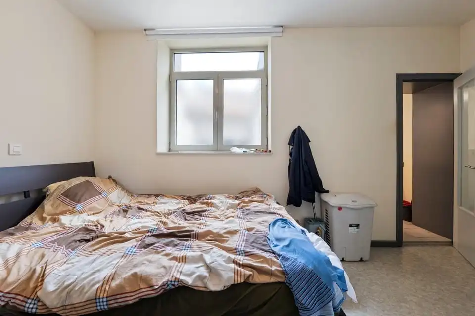 KNAP HANDELSPAND MET TWEE APART VERHUURDE APPARTEMENTEN IN HET CENTRUM VAN SINT-TRUIDEN foto 25