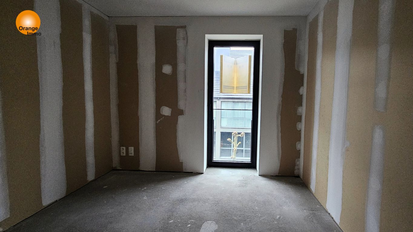 Ruim nieuwbouwappartement in het commercieel centrum van Eisden. foto 4