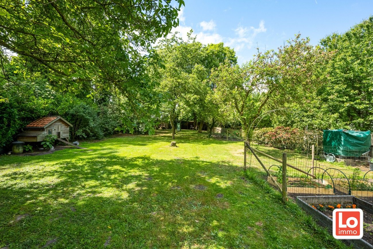 Charmante open woning met carport en héél grote aangename tuin gelegen op een toplocatie vlakbij het centrum van Zaffelare! foto 7