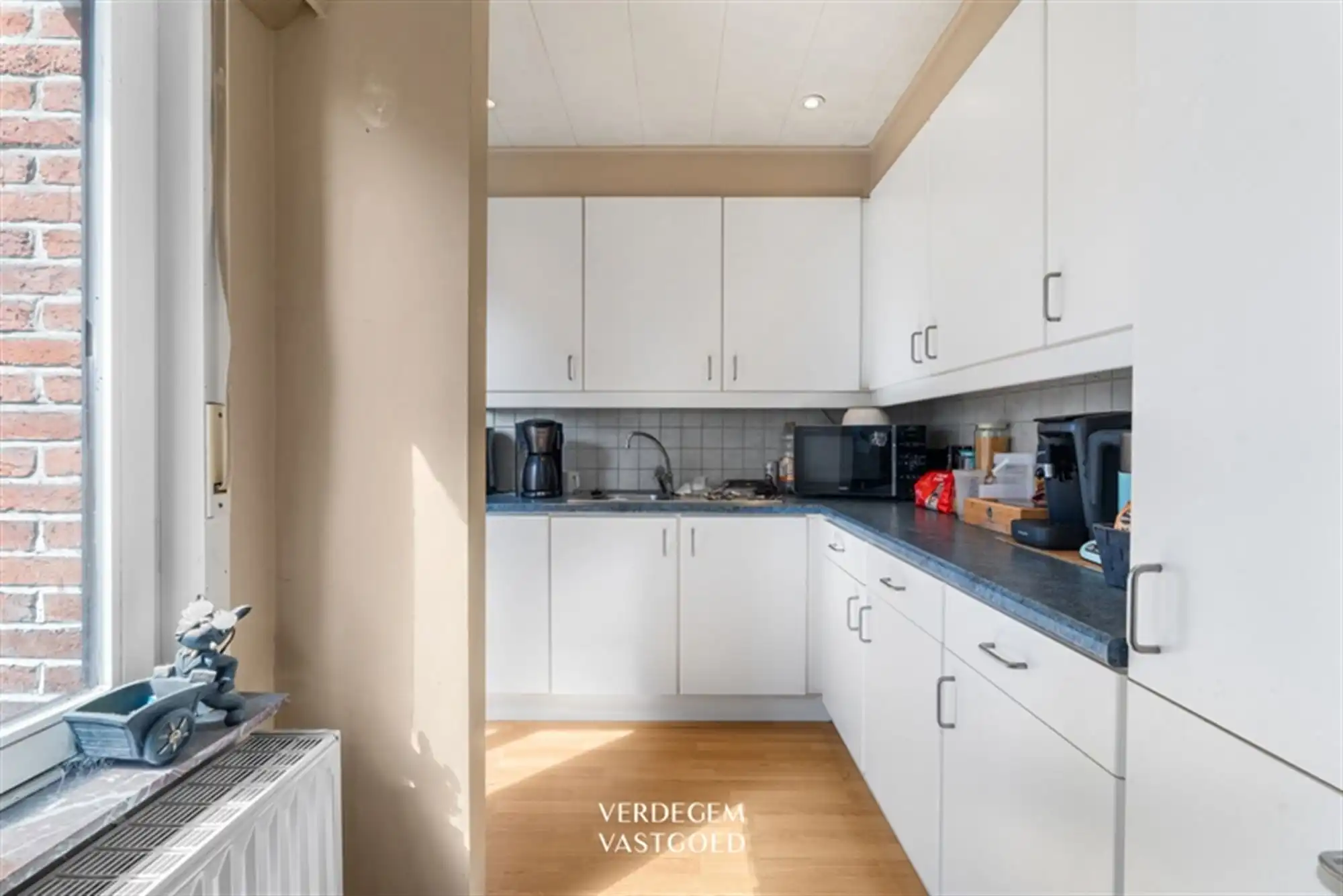 Opbrengsteigendom met 2 appartementen en 4 garages in het centrum van Sleidinge  foto 8