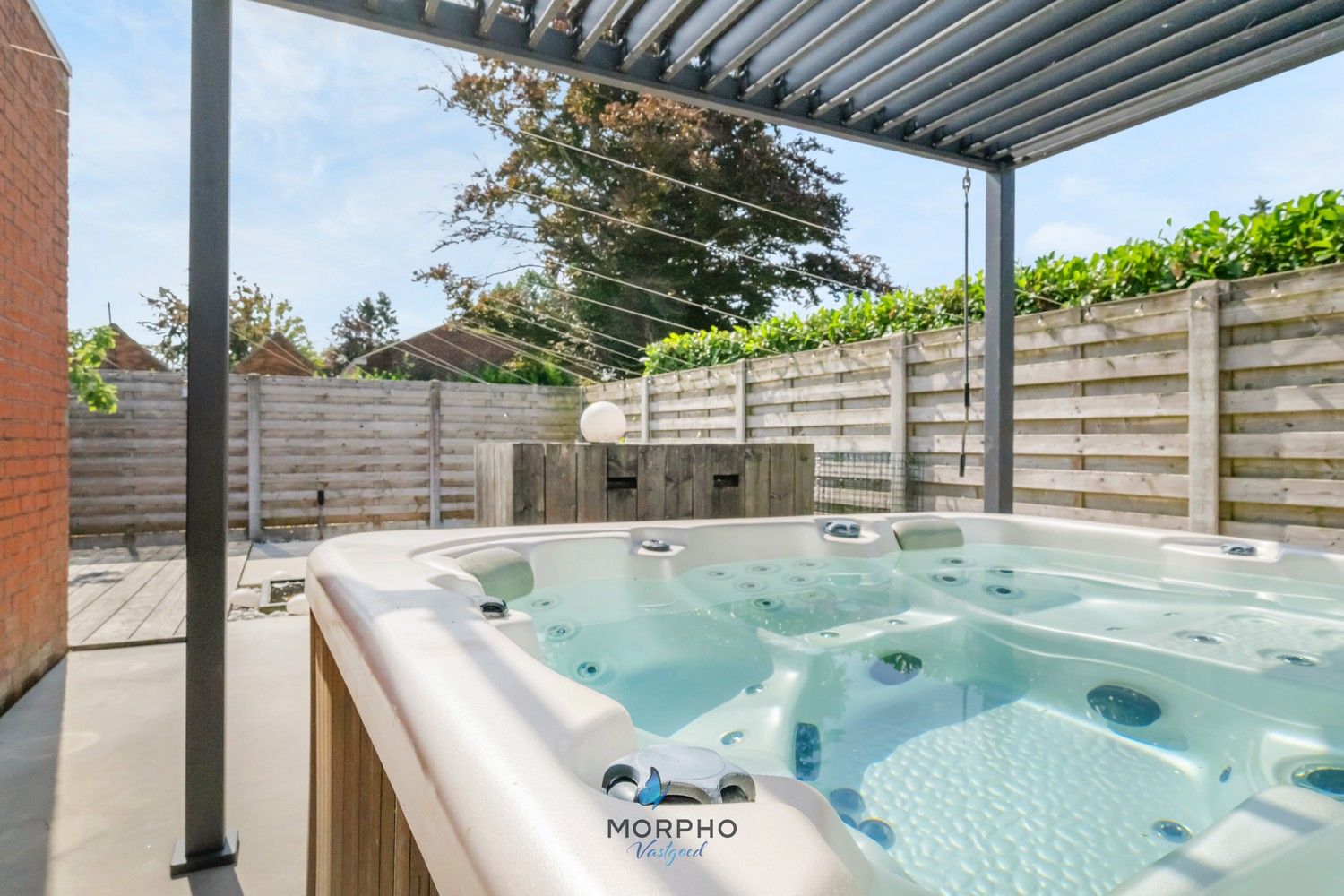 Ruime en energiezuinige woning met wellness, 4 slpks en praktische stadstuin in hartje Veldegem foto 2