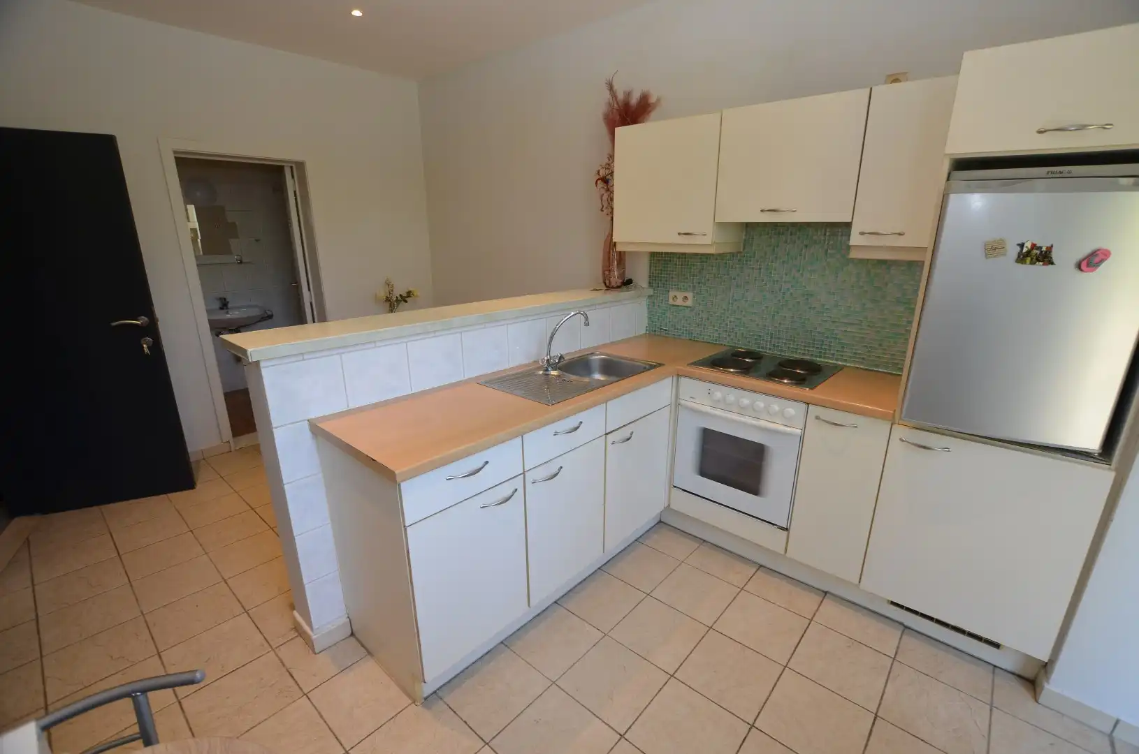 Gelijkvloers appartement met grote koer foto 6