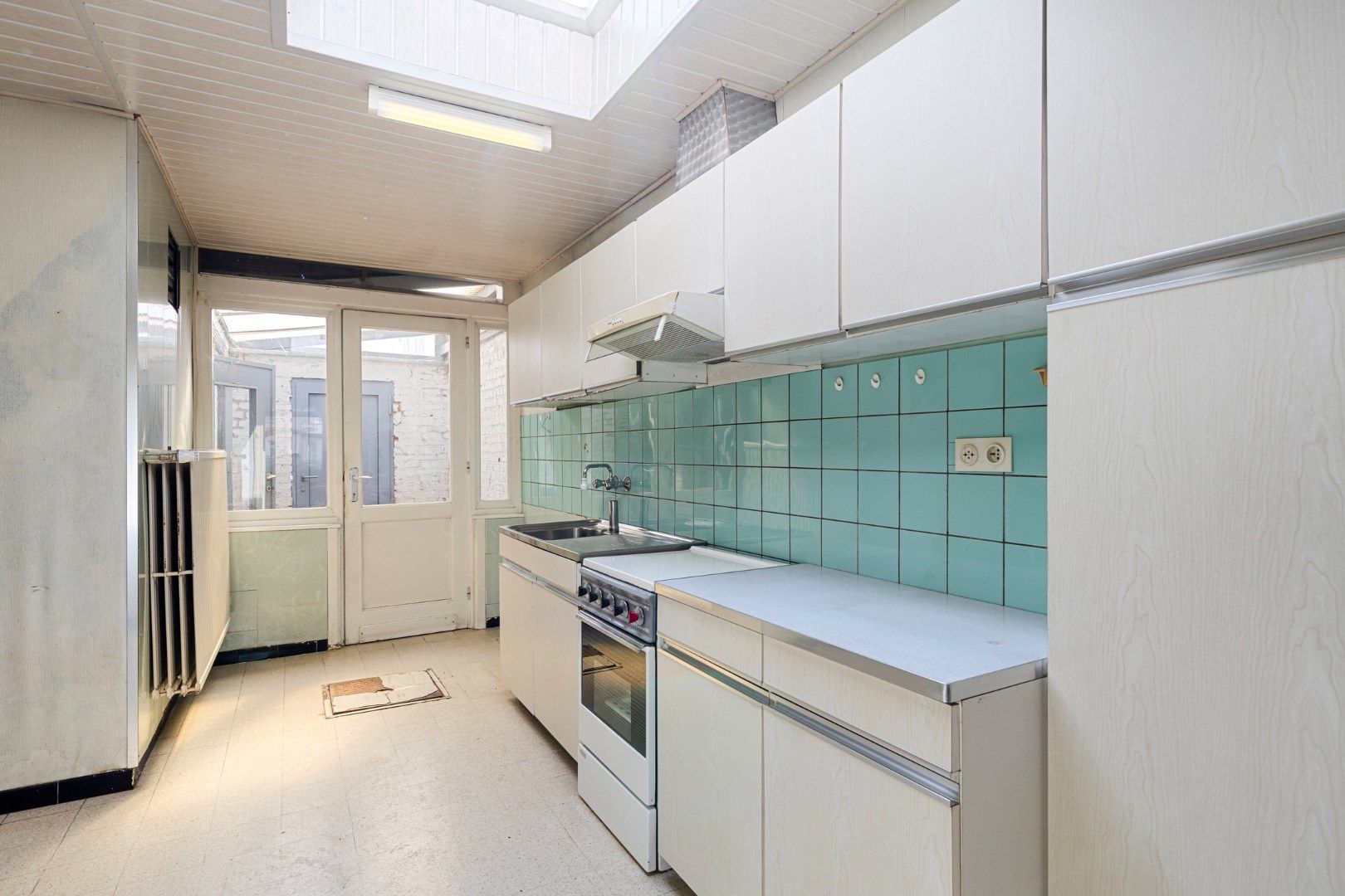 Te renoveren woning met 4 slaapkamers, garage en tuin in Kessel-Lo – EPC 906 kWh/m² - bewoonbare opp. 163 m² foto 7