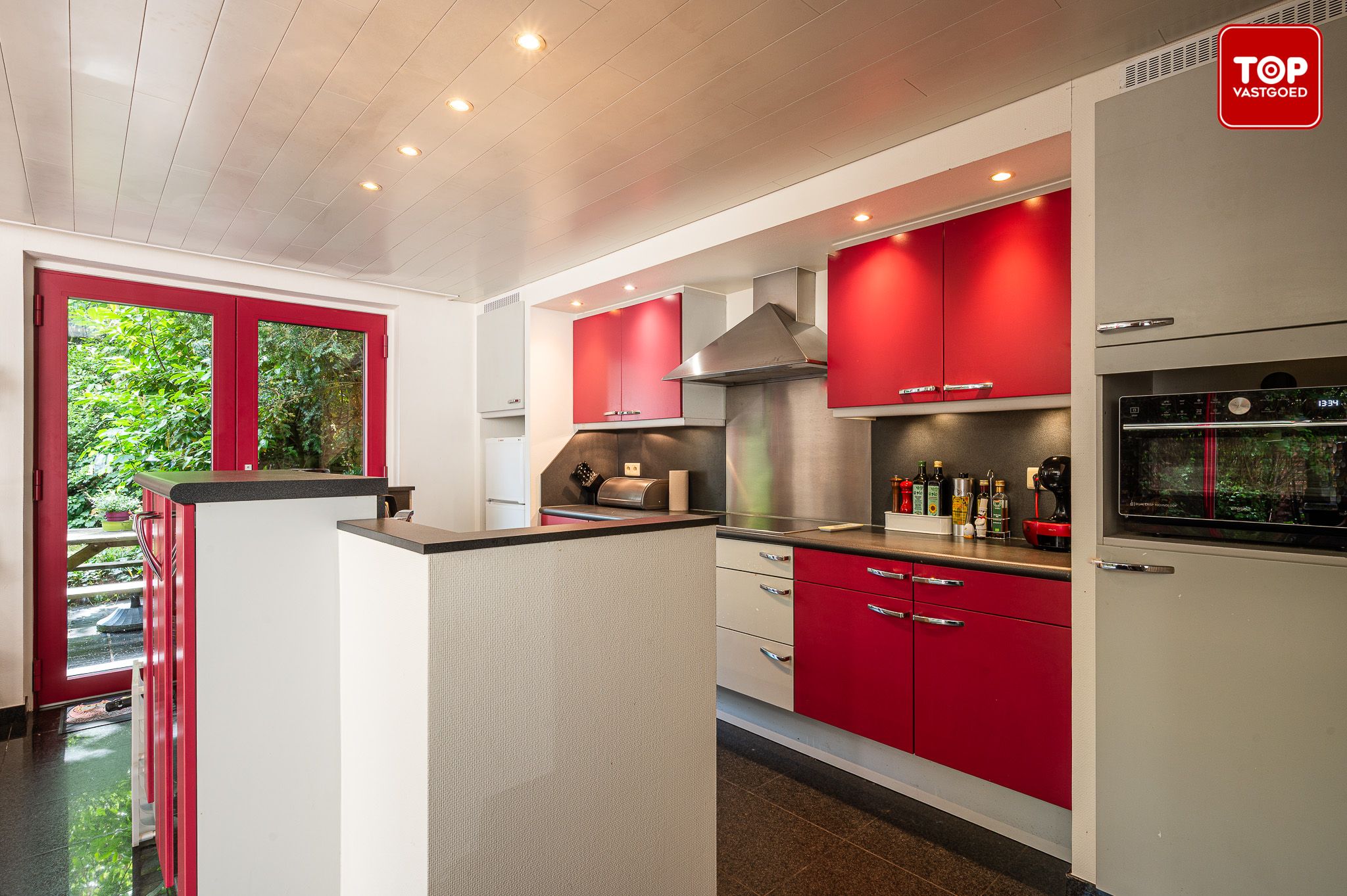Charmante halfopen woning met fantastische tuin op een Topligging in Sint-Denijs-Westrem foto 9